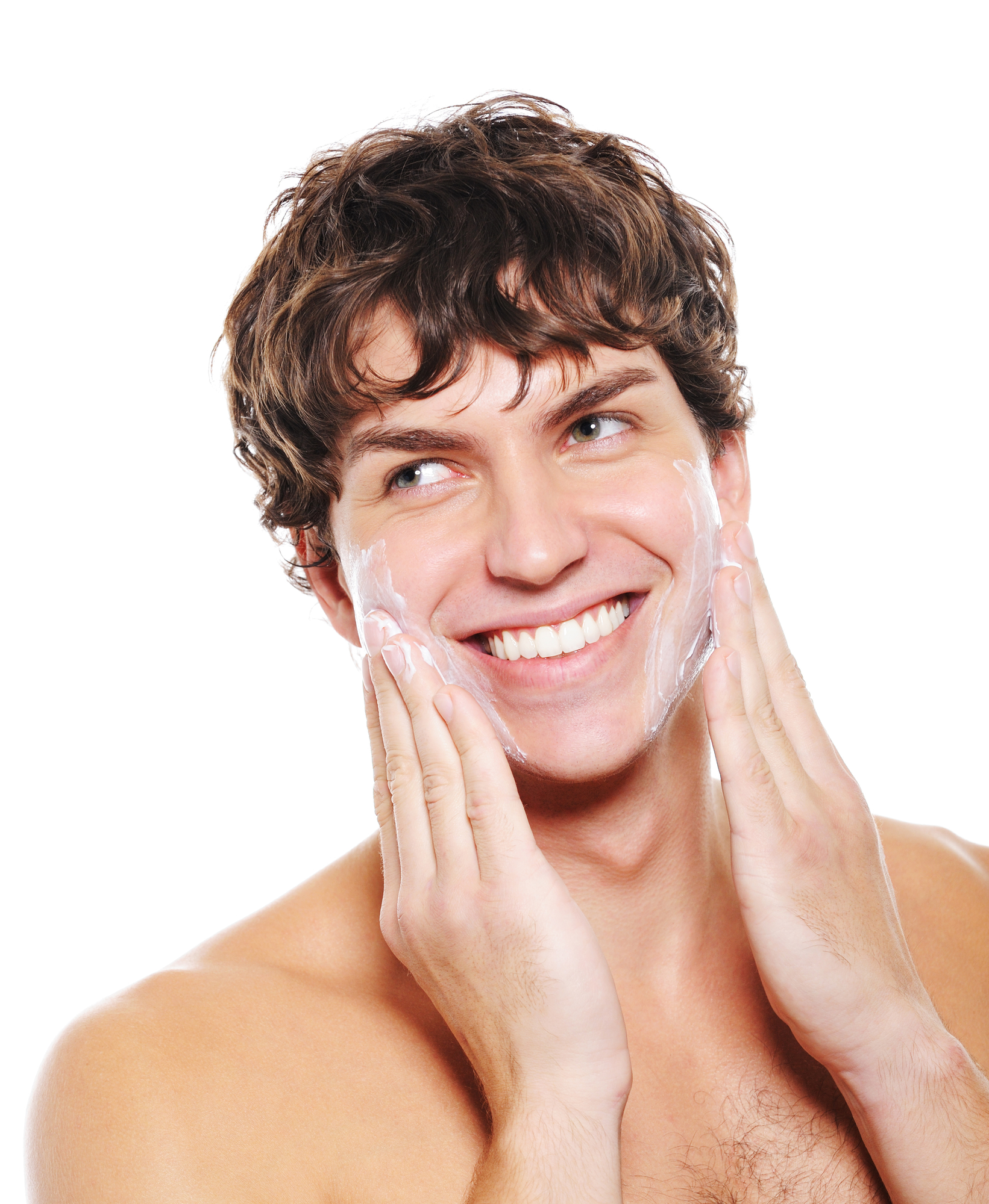Man with happy smile applying moisturizing lotion after shaving for his face